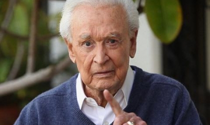 Bob Barker points his finger at the camera.