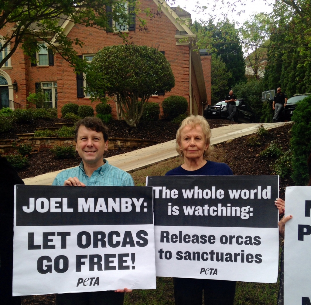 A group of people holding signs.