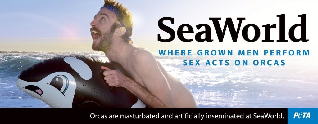 A man on an inflatable raft with the words seaworld.