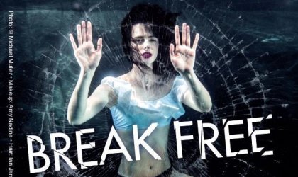 Krysten Ritter breaks glass in an ad titled "Break Free"