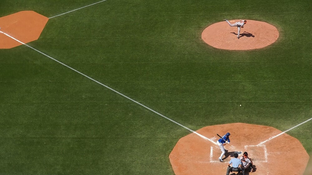 An overhead view of a baseball game with an orca tank.