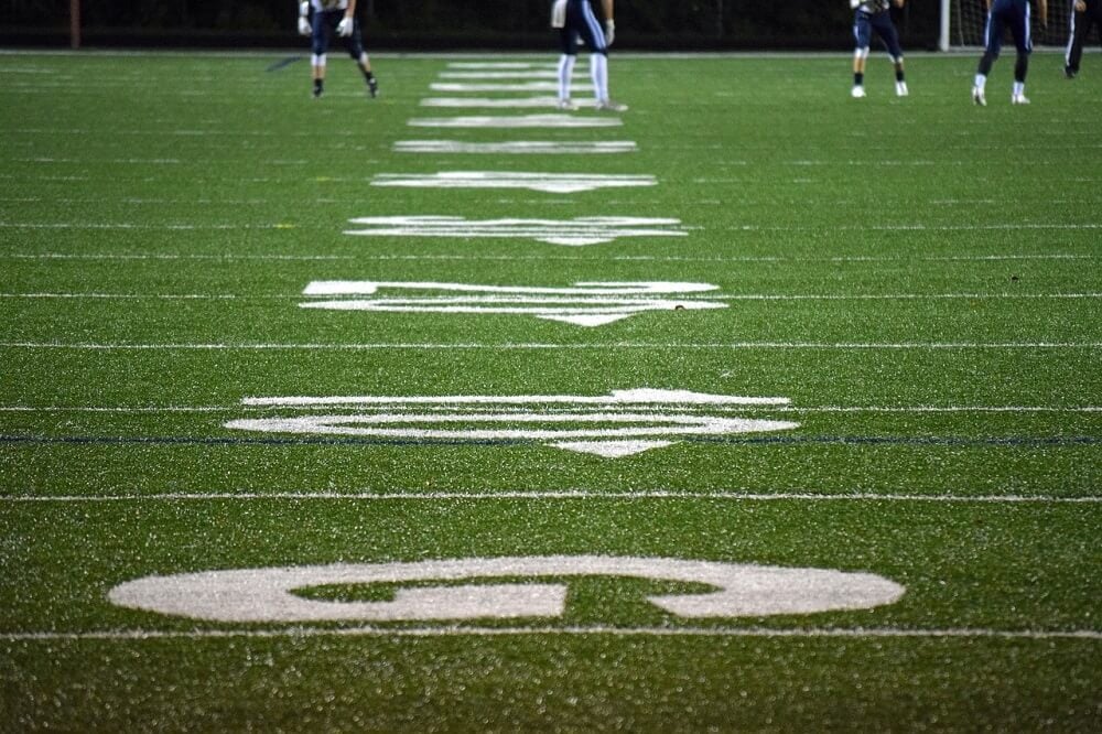 An image of a football field with numbers, Orca, and Tank.