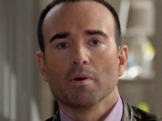 a closeup of a man's face as a CBS whistleblower discusses SeaWorld cruelty with former orca trainers